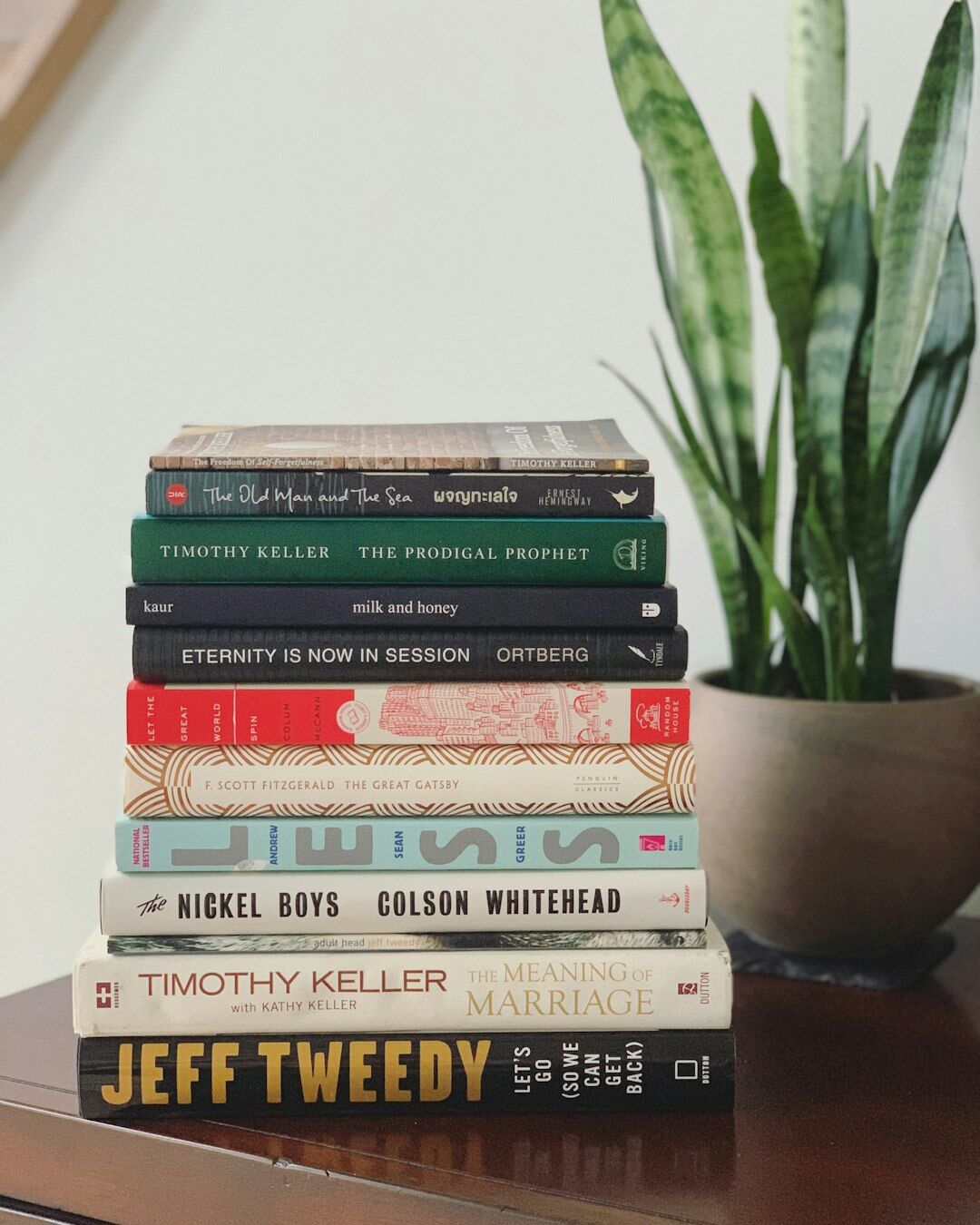 stack of mystery novels on table